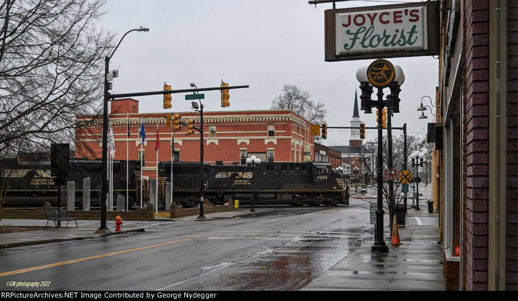 NS 4206 passing through downtown with an Auto train